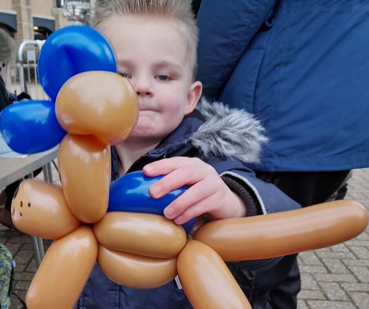 Child with balloon animal