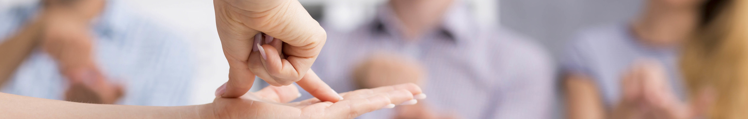 Students using sign language to communicate