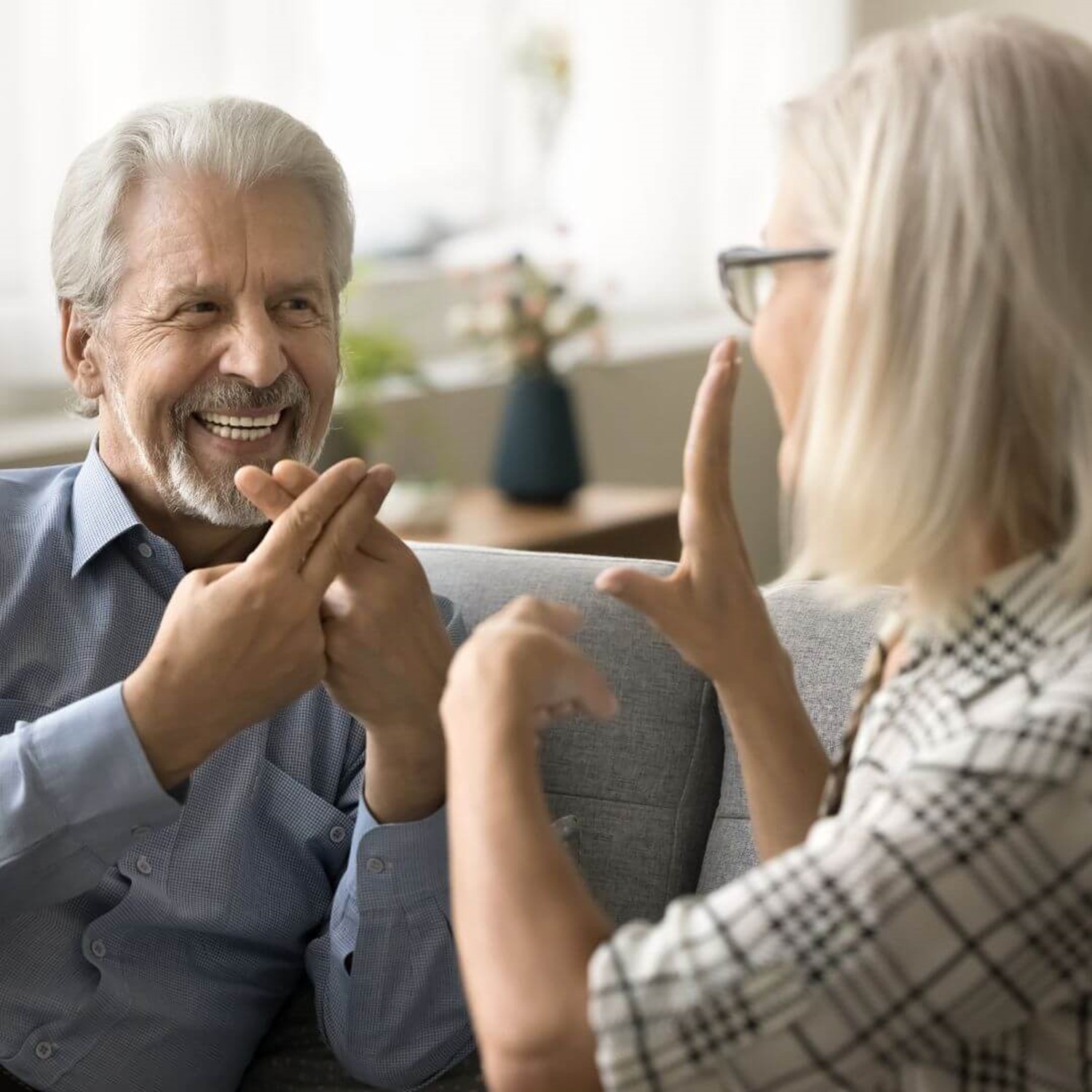 Two people communicating in sign language