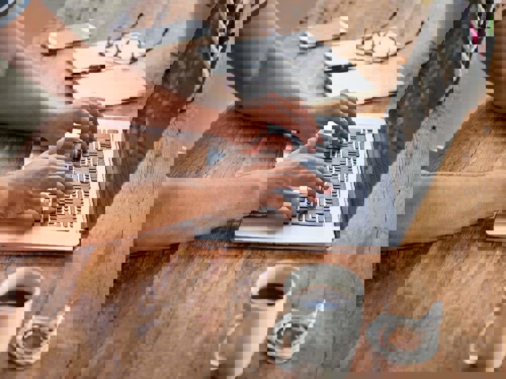 Person typing on a laptop