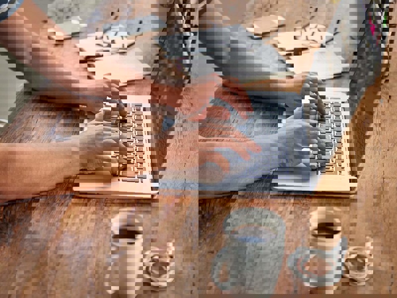 Person typing on a laptop