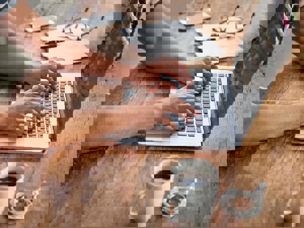 Person typing on a laptop