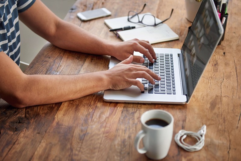 Person typing on a laptop