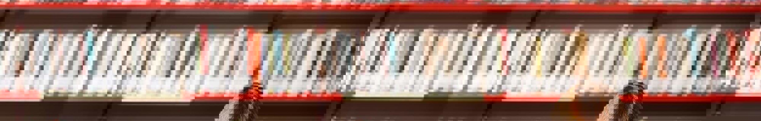 Woman reading a book in a library