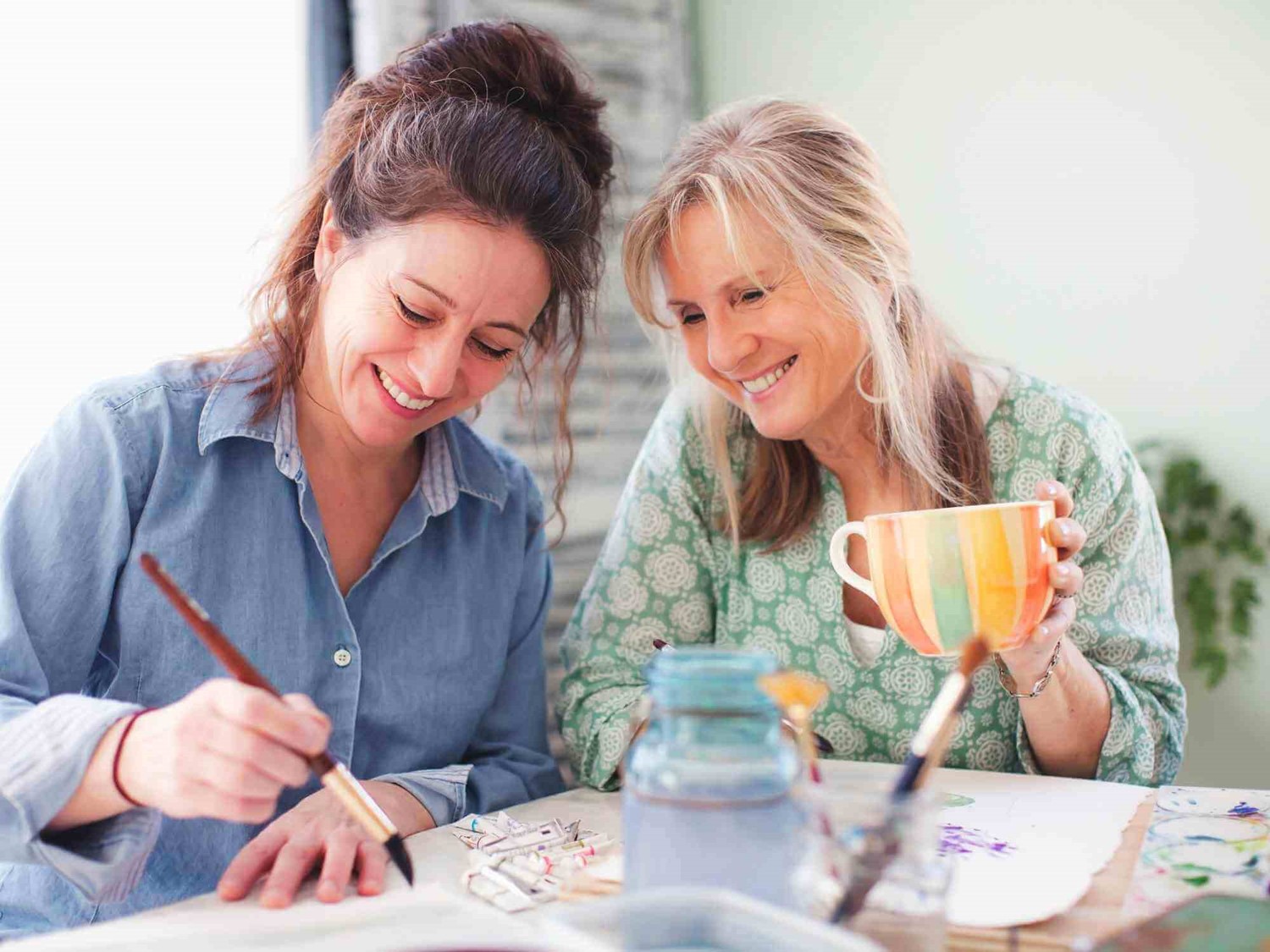 Two women painting