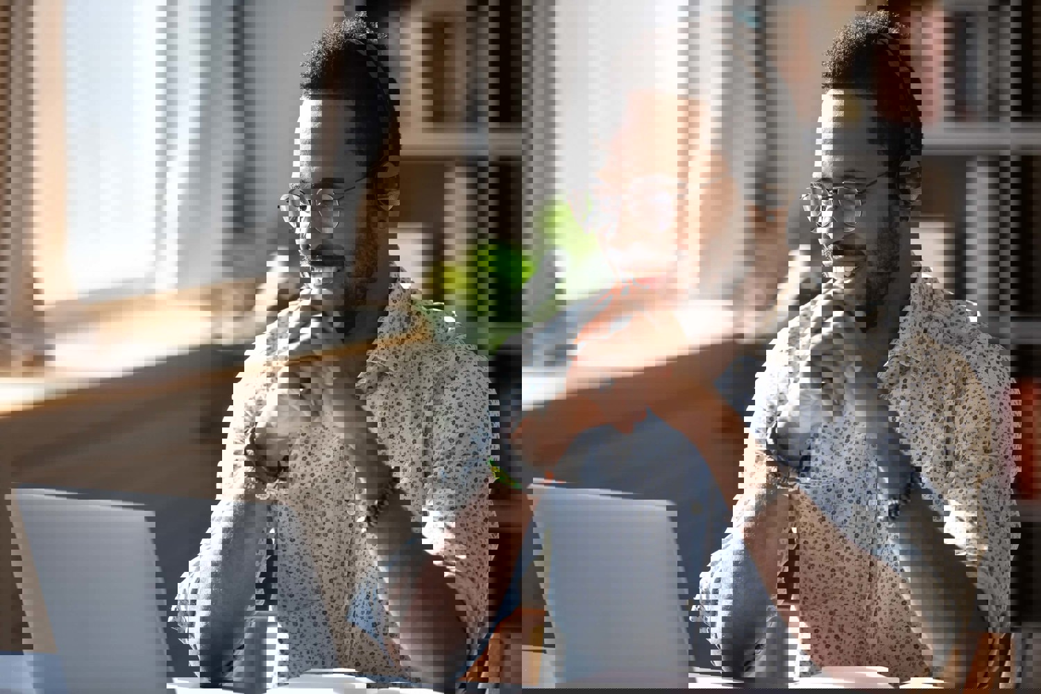 Man smiling at laptop