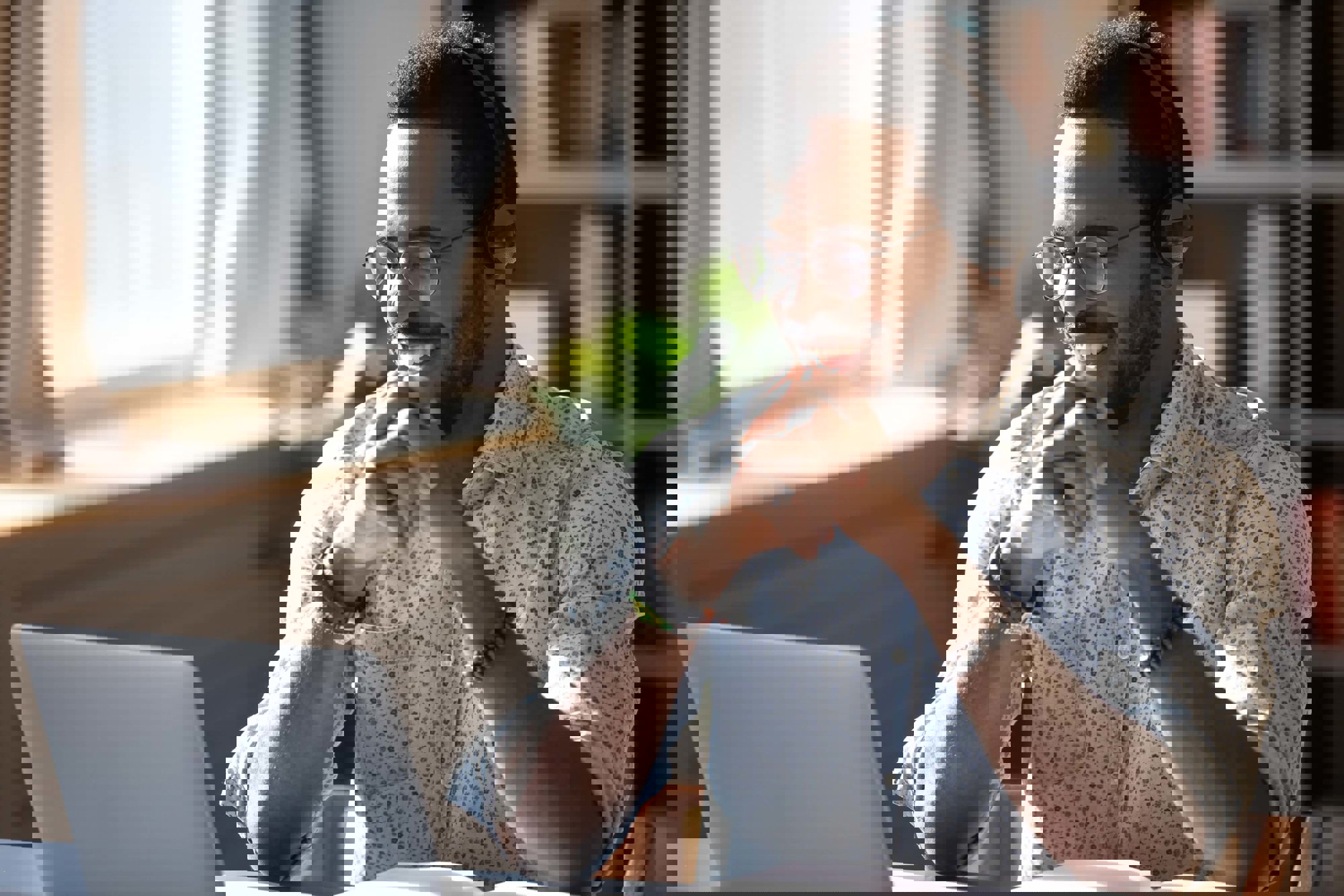 Man smiling at laptop