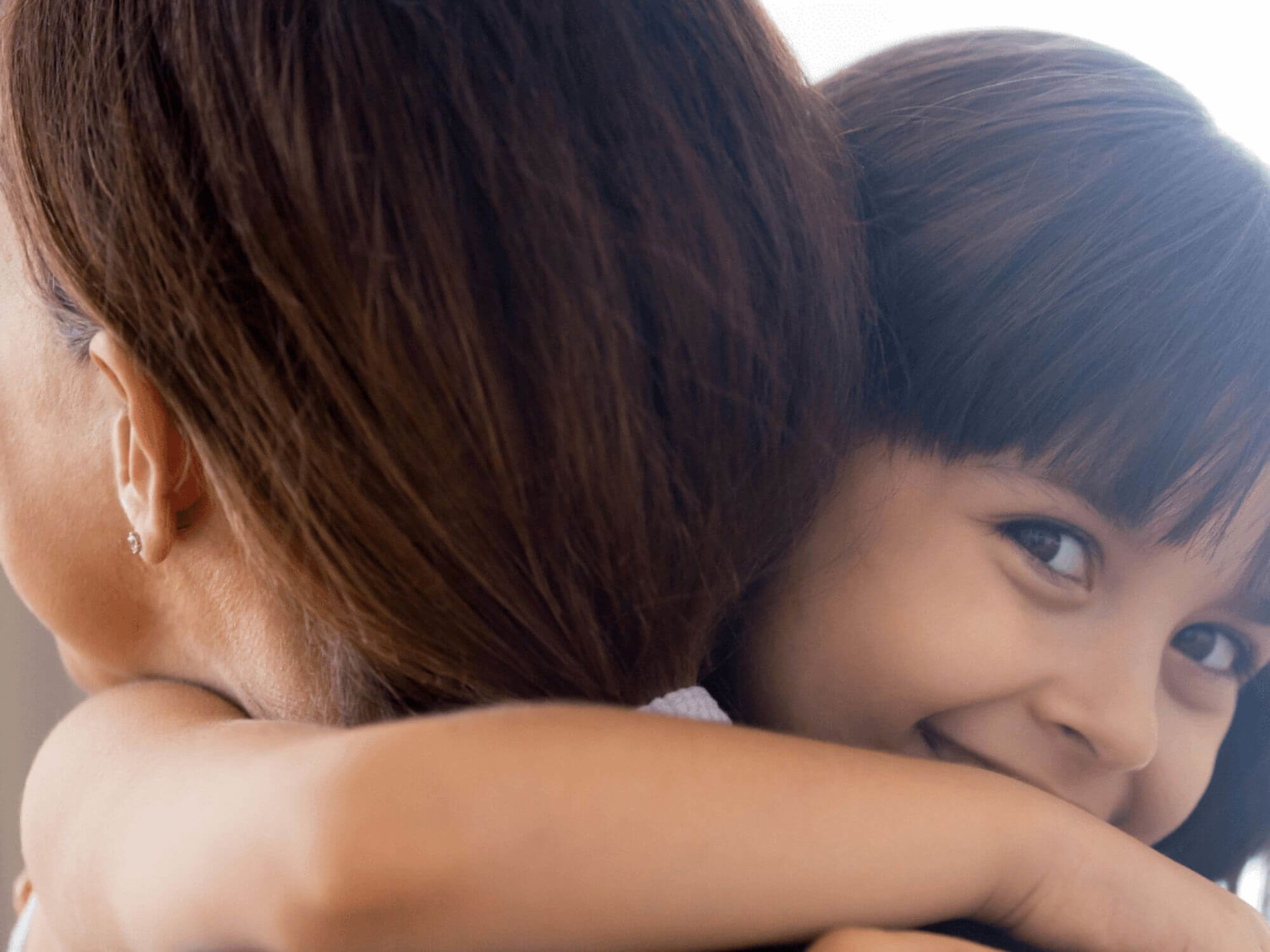Girl hugging woman