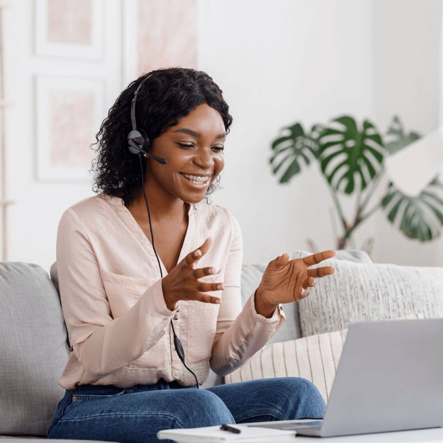 Lady with headset on laptop