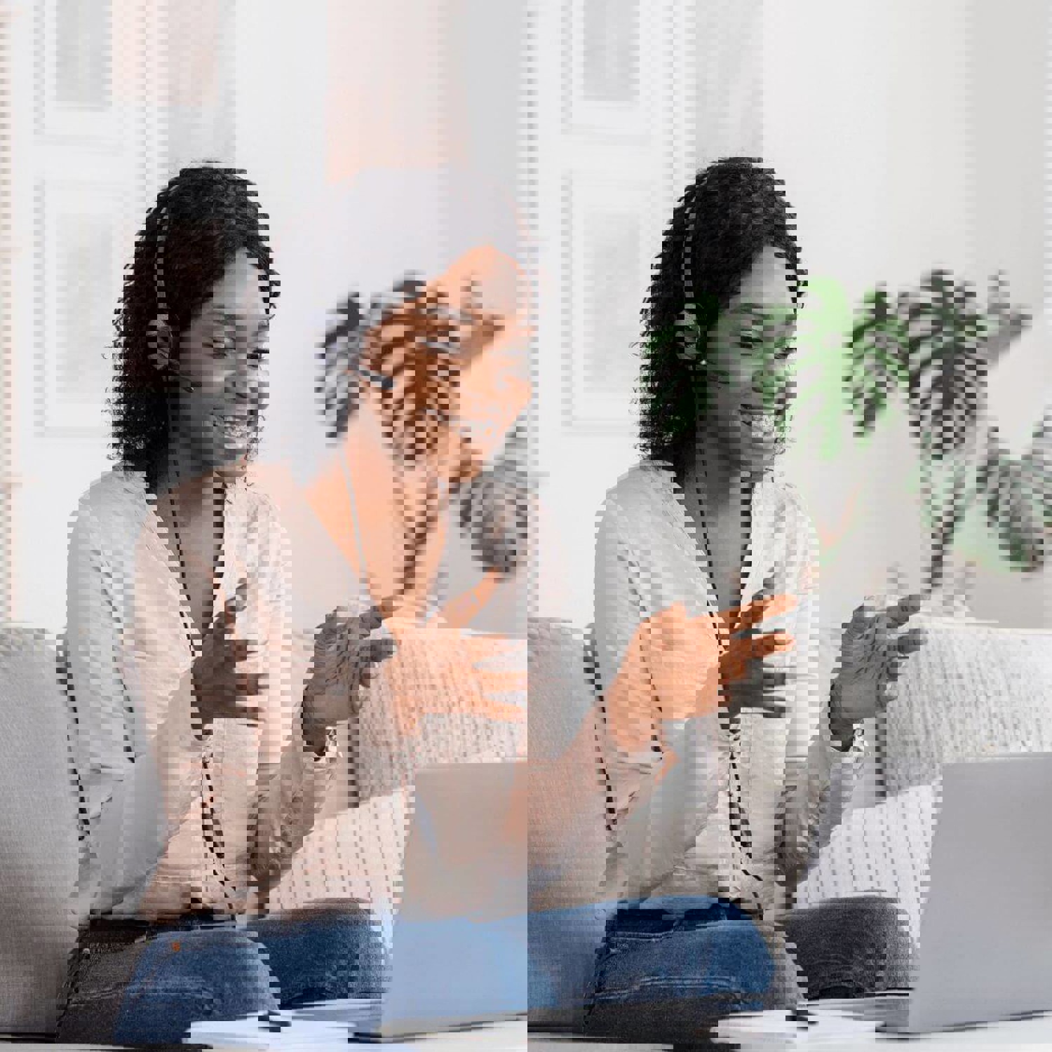Lady with headset on laptop