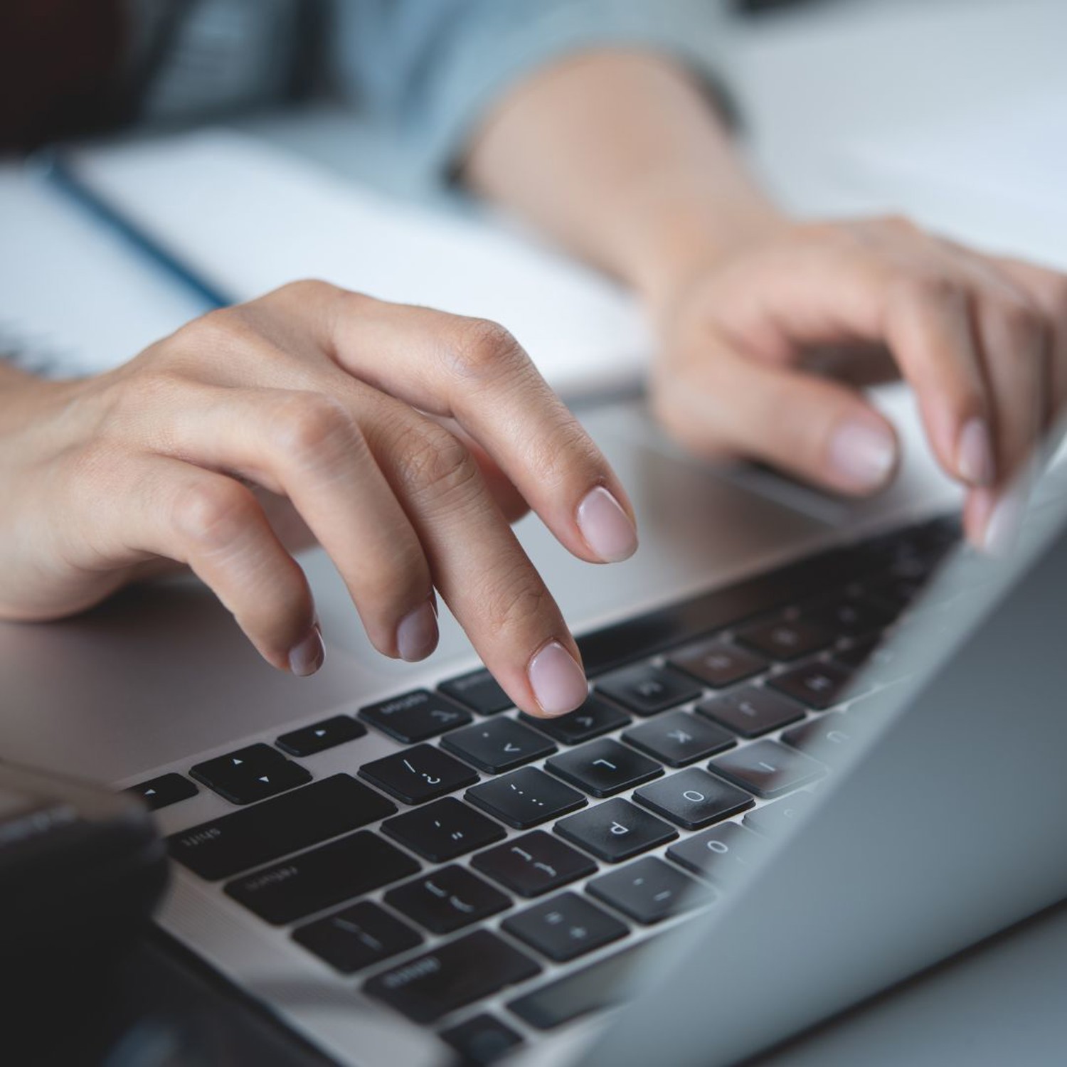 Person typing on a laptop