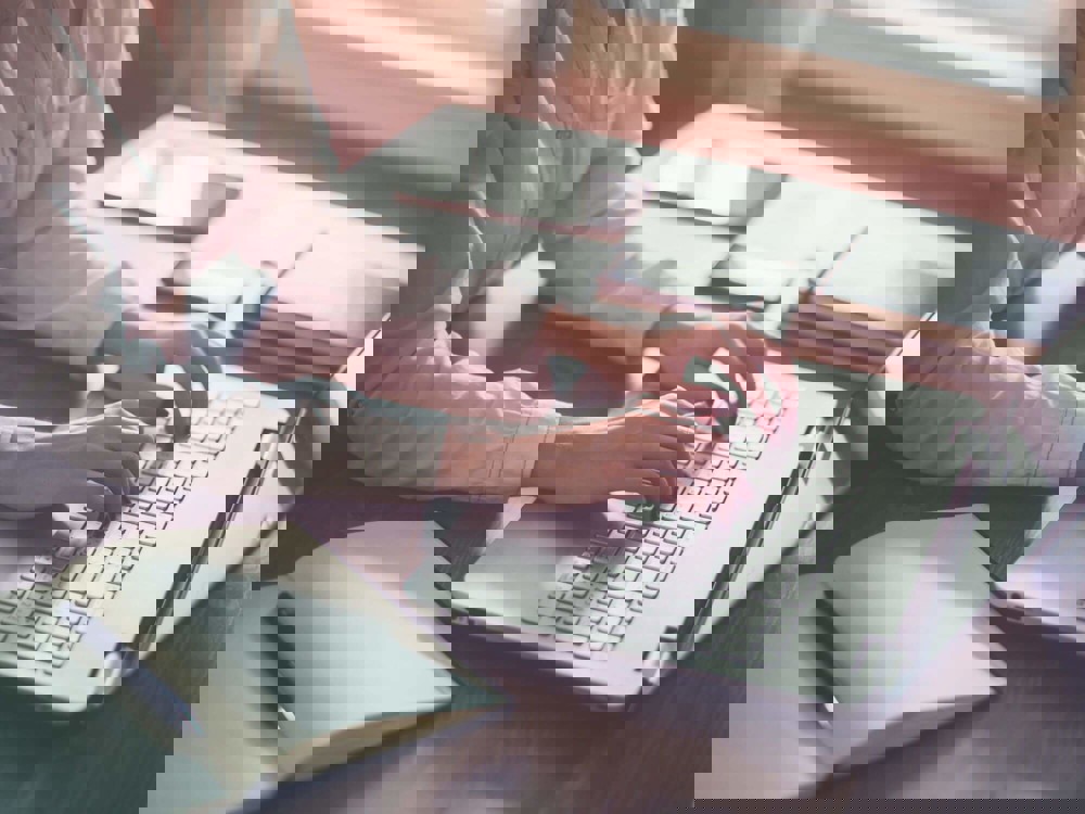 Woman typing on laptop