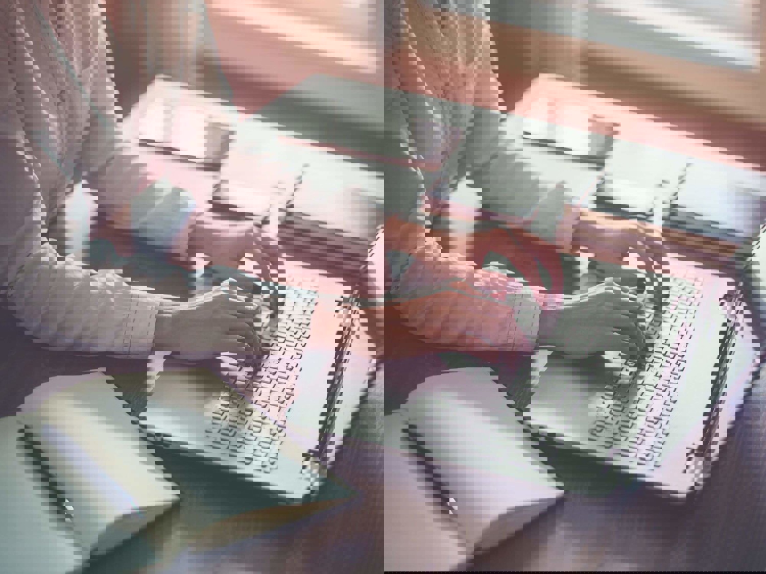 Woman typing on laptop