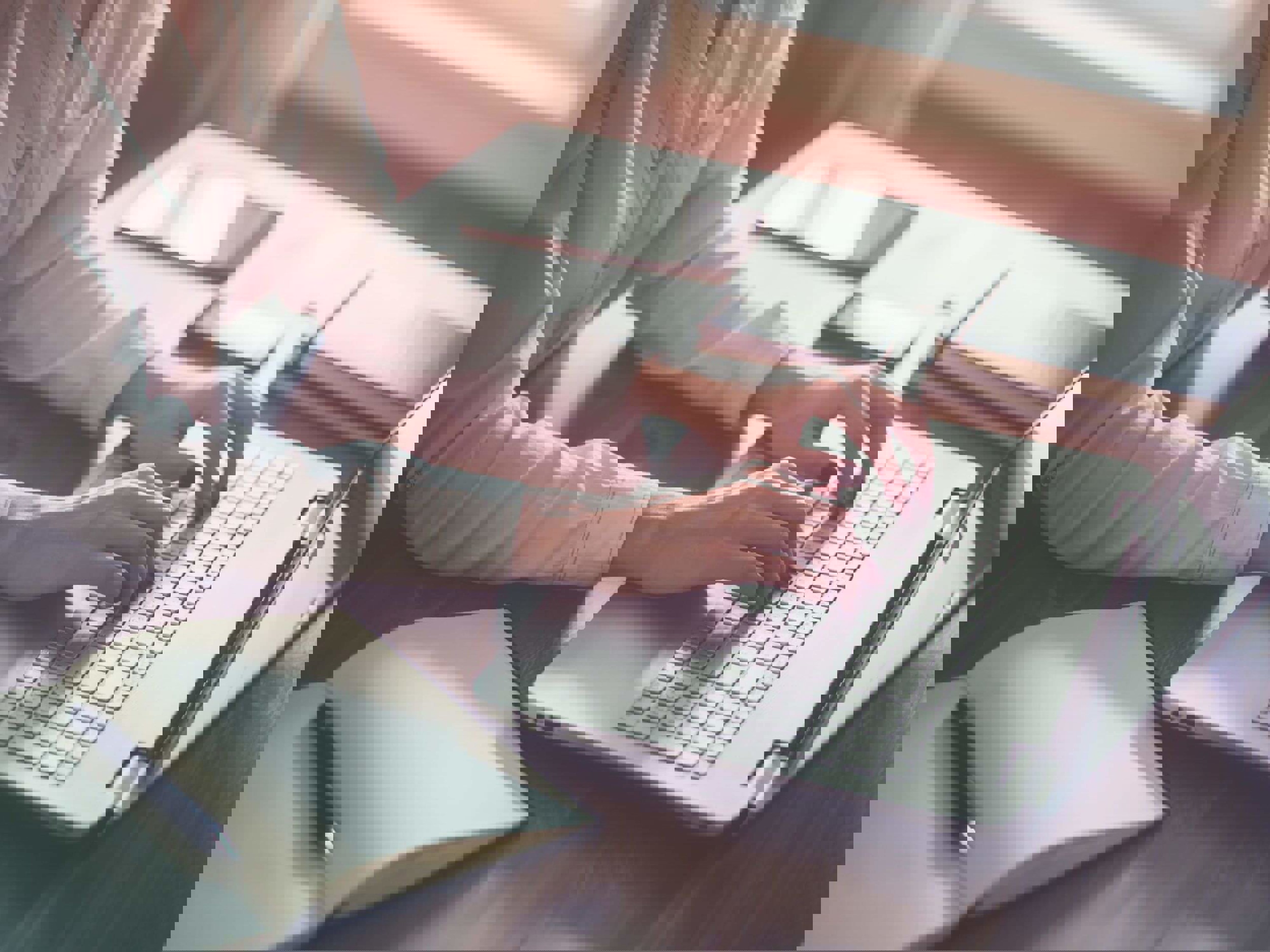 Woman typing on laptop