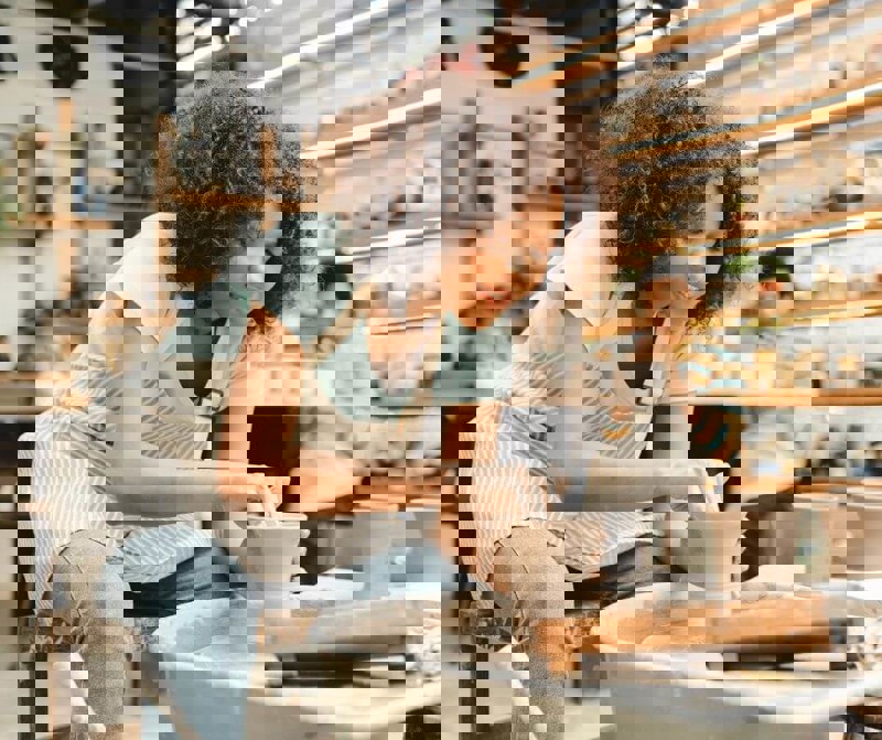 Person making pottery