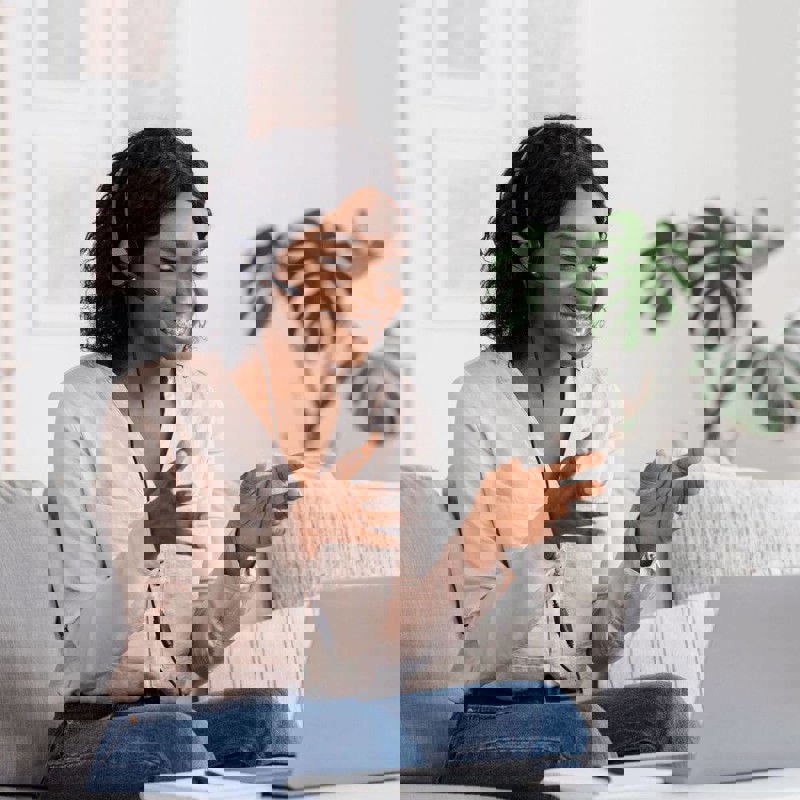 Girl smiling on laptop