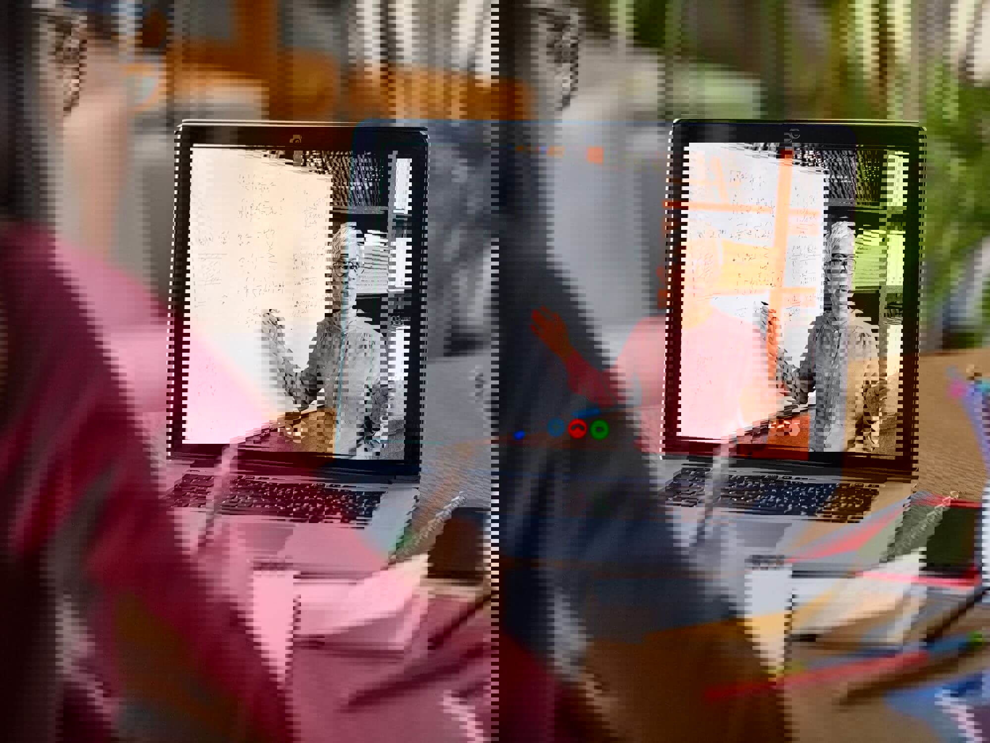 Woman on laptop watching online class