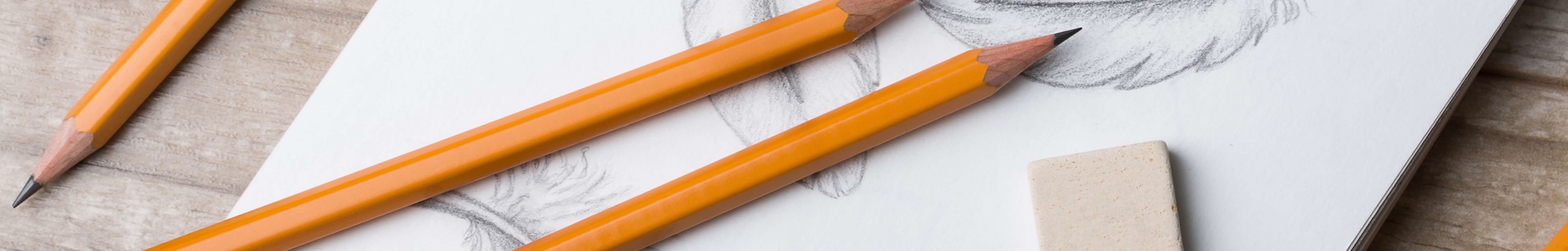 Pencils on top of sketchbook