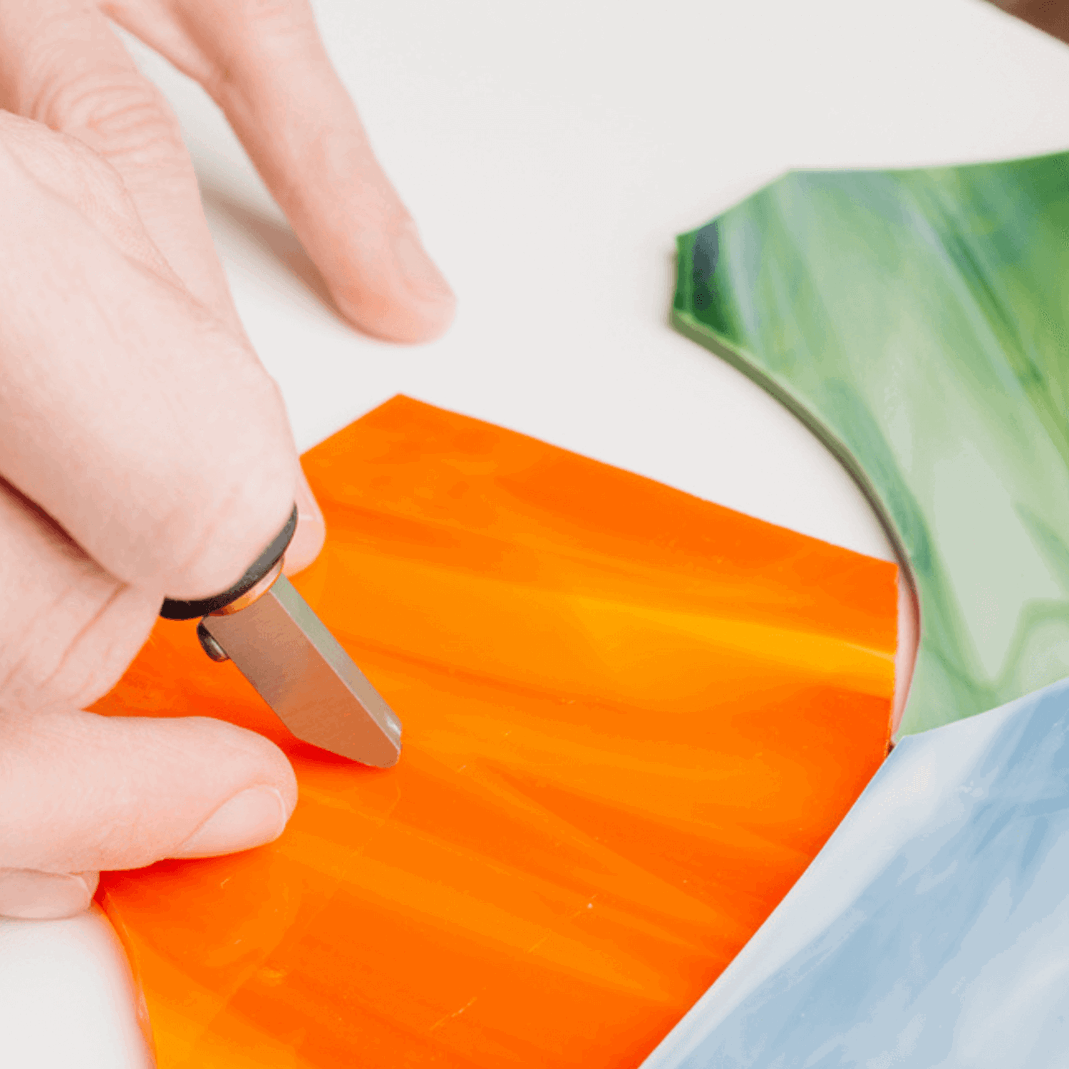 Close up of person touching glass tiles