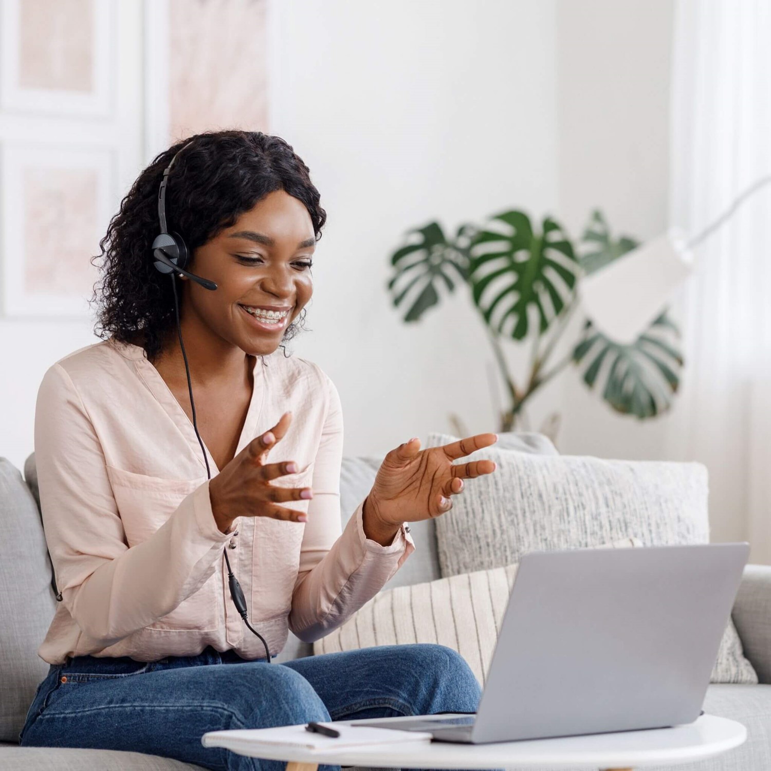Lady with headset on laptop