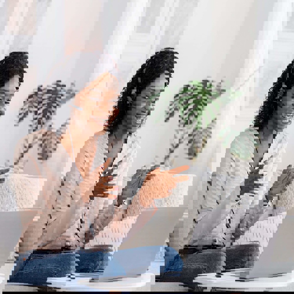 Lady with headset on laptop