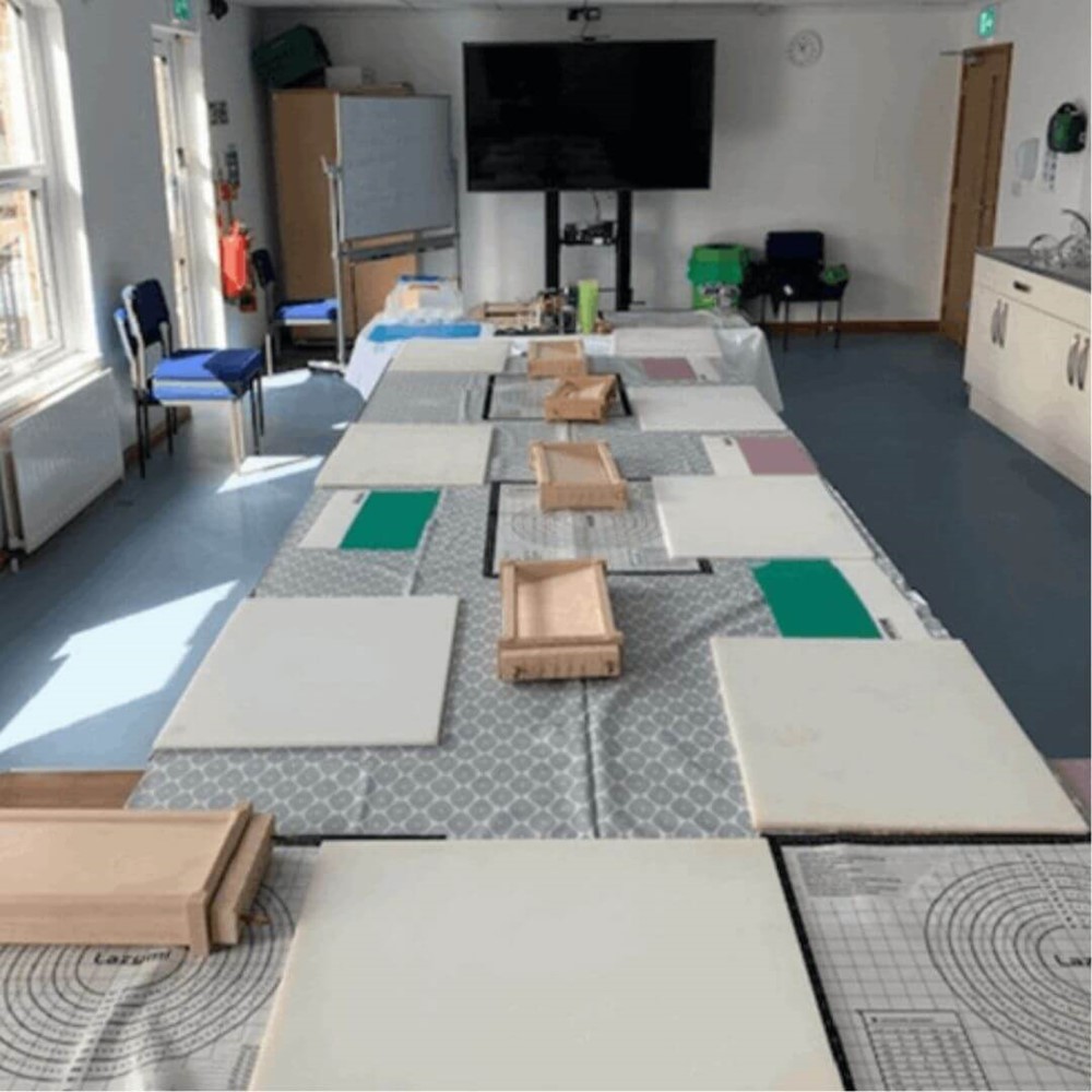 Classroom with chopping boards on table