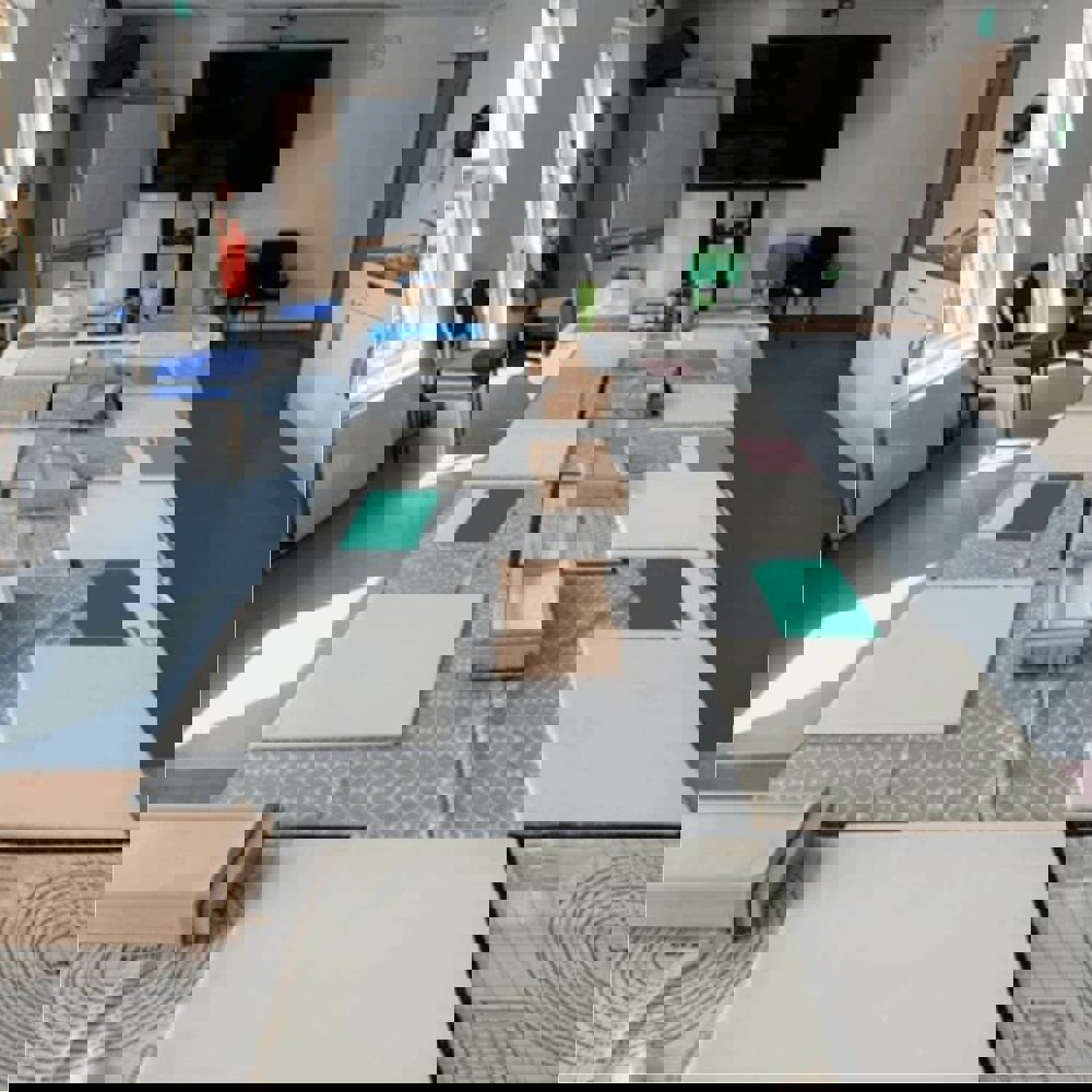 Classroom with chopping boards on table