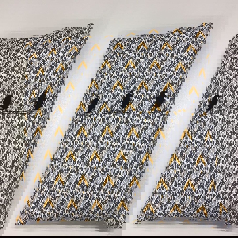 Patterned mustard and blue cushion