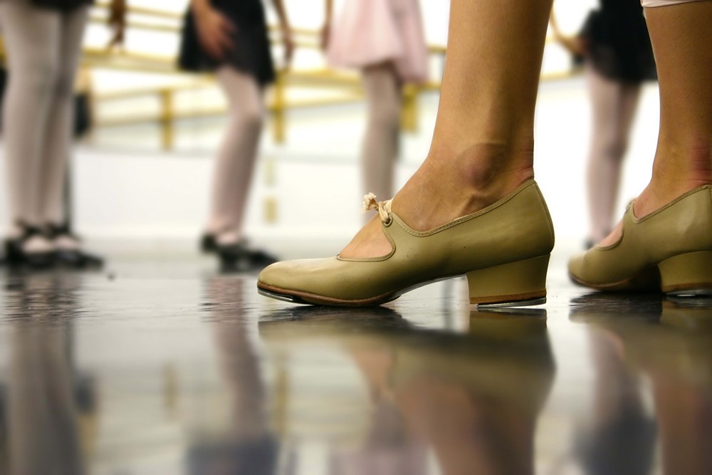 Lady teaching class in her dance shoes