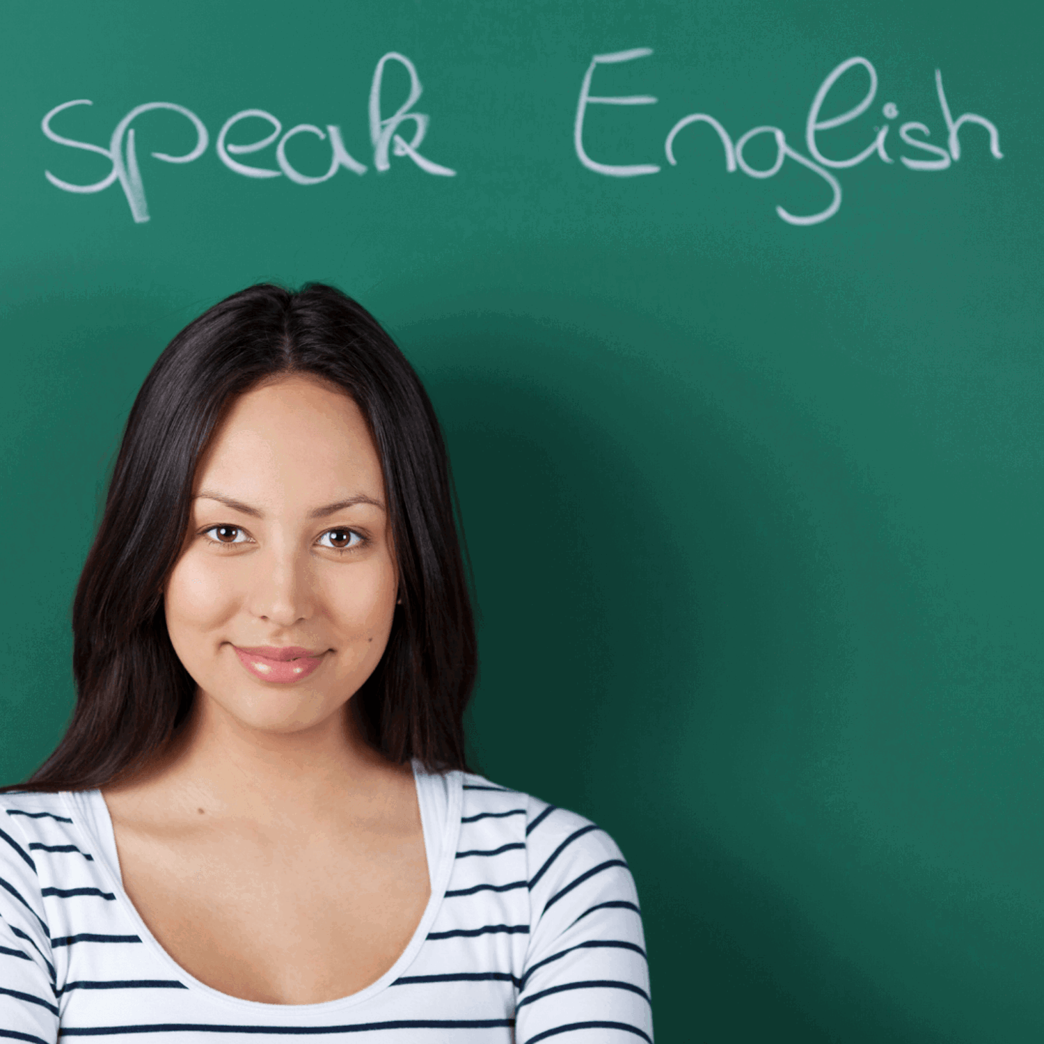Girl infront of blackboard that reads speak English