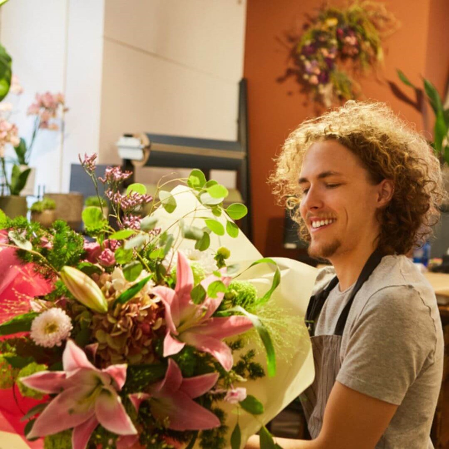 Male holding bunch of flowers