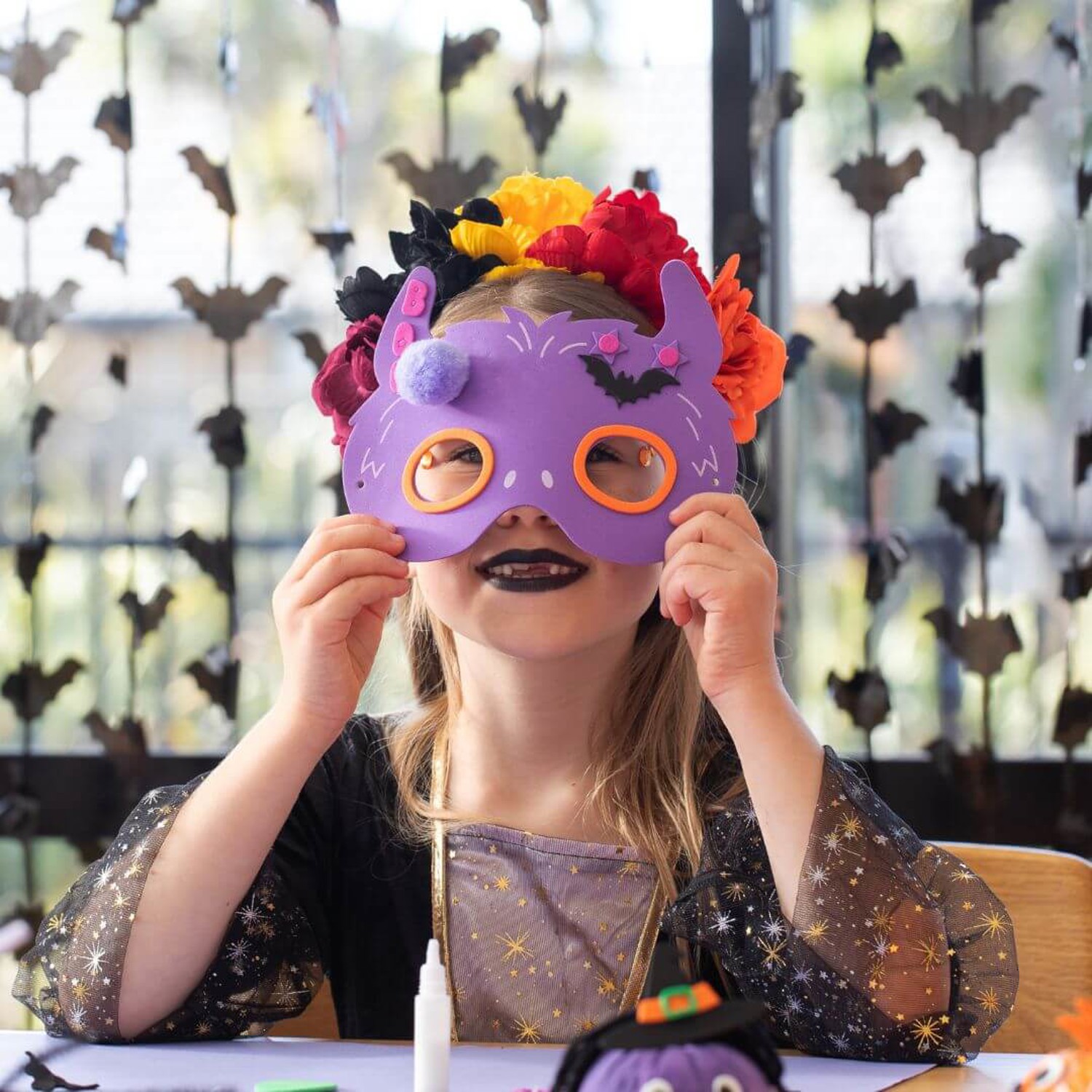 Child making a Halloween Mask