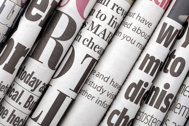 Close up of a range of newspapers