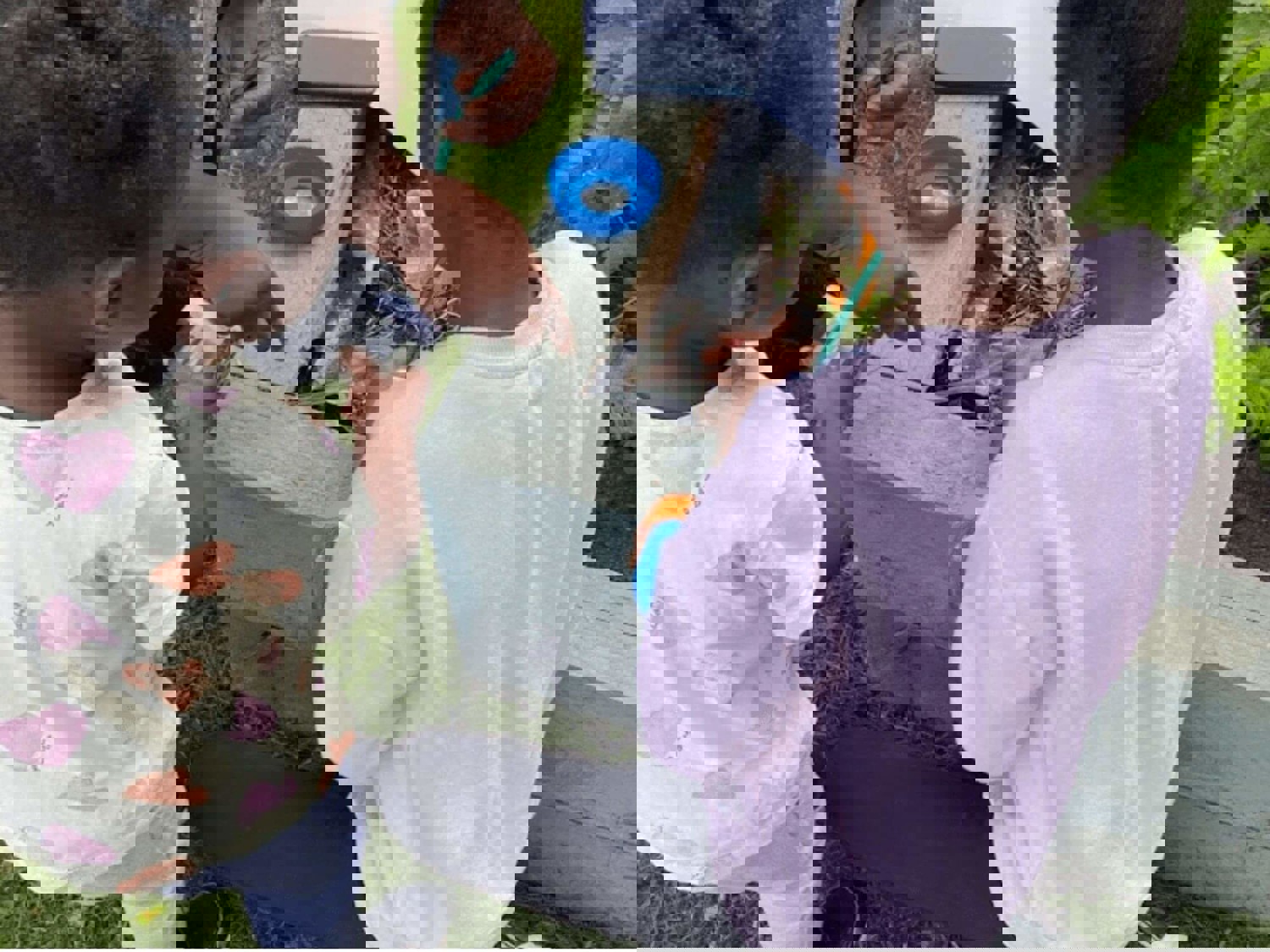 Two children bug hunting