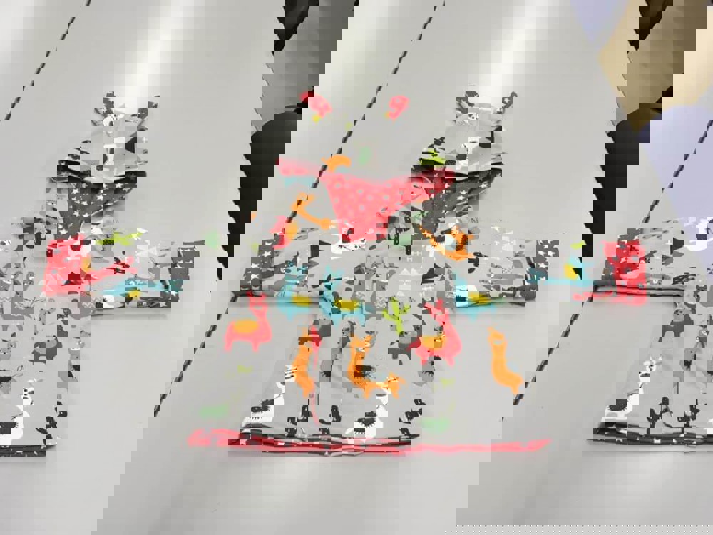 Children's coat with lama pattern