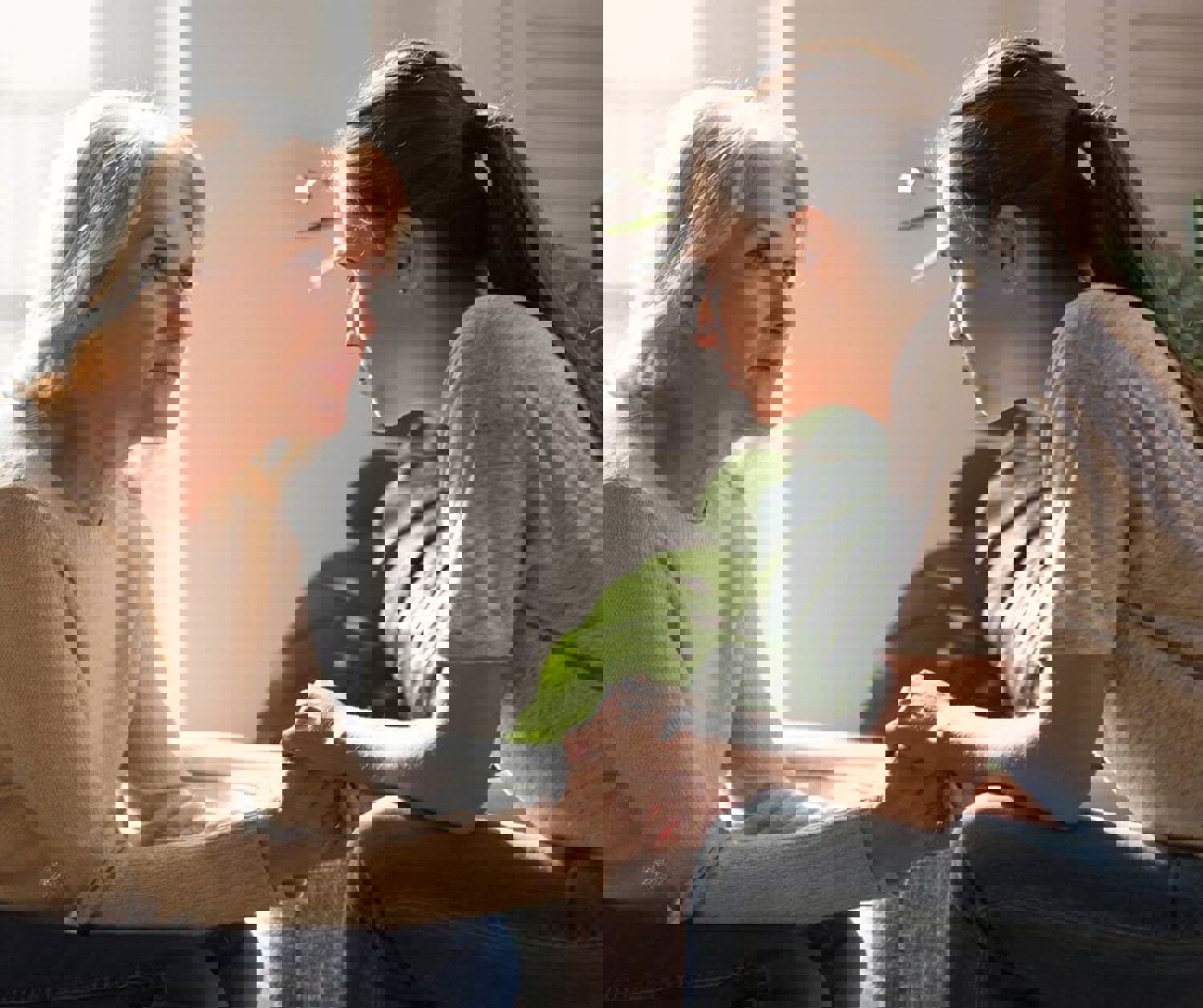 Parent and child holding hands and talking